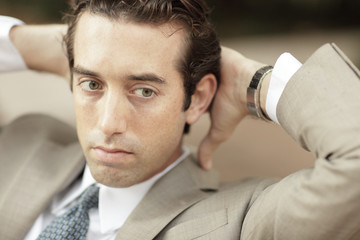 Obraz premium Businessman with hands behind his head