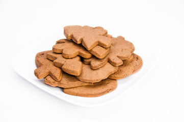 Plate of homemade gingerbread cookies on isolating background