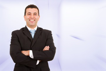 Portrait of a laughing young business man at the office