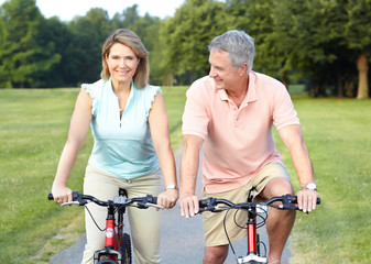 senior couple cycling