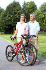 senior couple cycling