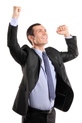 Portrait of a young happy businessman with raised hands