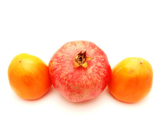 Fototapeta na wymiar Pomegranate and a persimmon