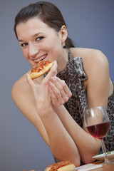 woman holding pizza