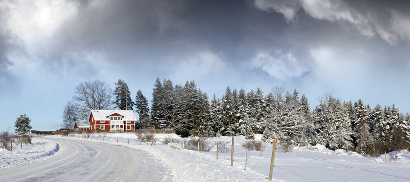 red cottage in winter scenery
