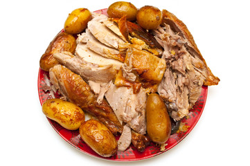 carved, sliced turkey served with potatoes isolated on white