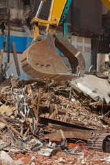 Equipment Claw, Pile of Debris Building Demolition Work Site