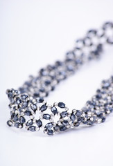 Silver necklace with gems isolated on white