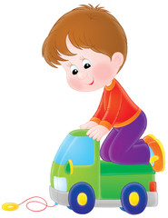 Boy plays with a toy car