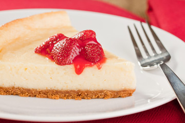 Fresh baked cheesecake with strawberry topping