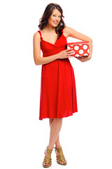 Full length shot of a pretty girl with a present