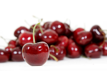 Fresh red cherry isolated on white background