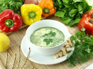 Bowl of green herbs soup