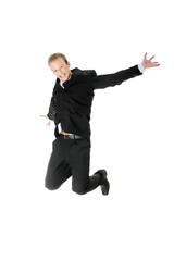 Young happy caucasian businessman jumping