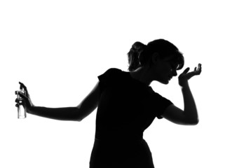 silhouette woman smelling perfume