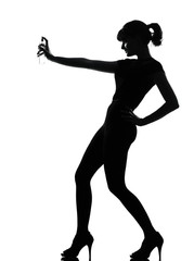Obraz na płótnie Canvas silhouette woman spraying perfume