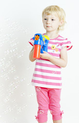 little girl with bubbles maker
