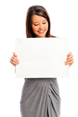 Pretty girl holding a white board