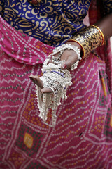 indian woman showing traditional jewelry.