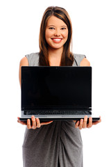 Pretty businesswoman holding a laptop