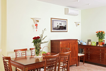 Dining room interior with classic wooden furniture