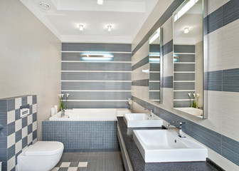 Fototapeta na wymiar Modern bathroom in blue and gray tones with mosaic