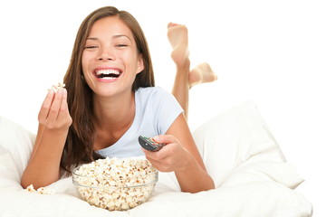 Woman watching funny movie laughing
