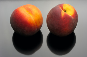 Peaches on a black background.