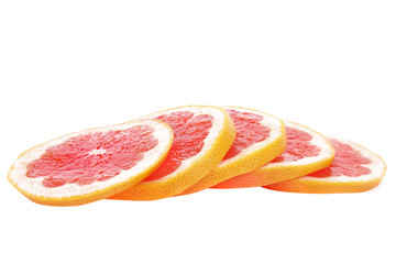Slices of pink grapefruit isolated on white