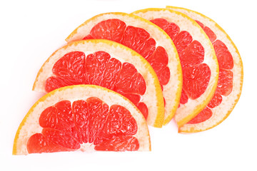 Close up of sliced pink grapefruit isolated on white