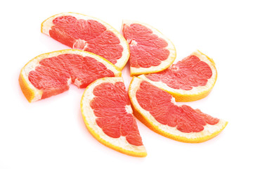 Fototapeta na wymiar Slices of grapefruit in the form of circle isolated on white