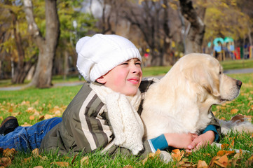 Boy playing in autumn park