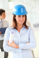 Architect wearing blue security helmet