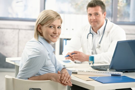 Smiling woman in doctor's office