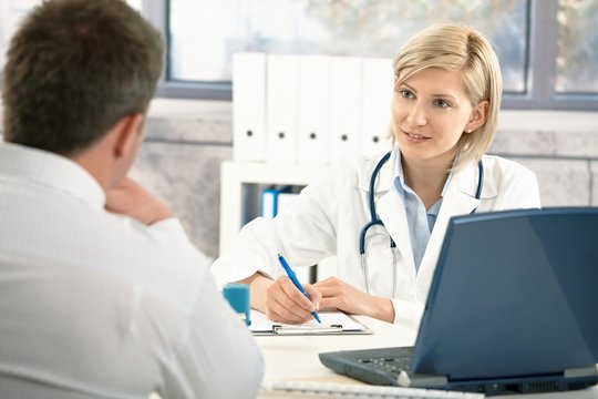 Doctor taking notes about patient