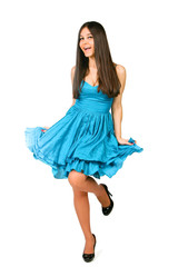 Beautiful Asian girl in a blue dress dancing