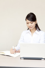 a portrait of young business woman working