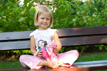 Fototapeta girl playing with dolls obraz