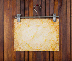 grunge paper on background wooden wall