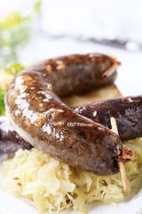 Sausages, sauerkraut and baked potato