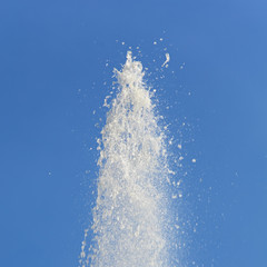Water Flowing From Fountain Against Clear Blue Sky
