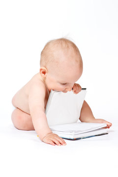 Small baby boy with book