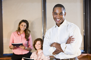 African American businessman with coworkers