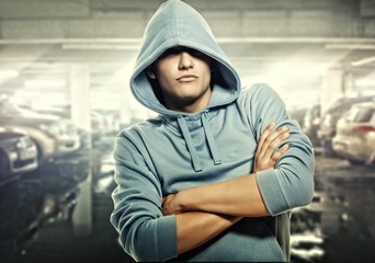 Young handsome man in a hood