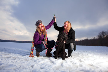 Two Blonde Woman Posing and Having Fun on Snowy Landscape