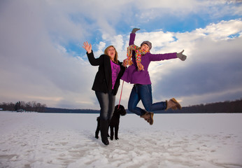 Two Blonde Woman Posing and Having Fun on Snowy Landscape