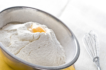 White flour and egg  in bowl