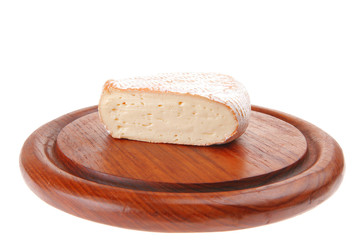 soft cheese served on wood
