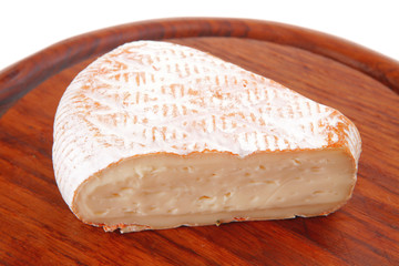 cheese on wooden plate