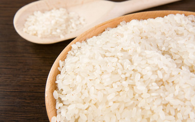 rice and plate with wooden spoon